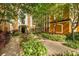 Exterior courtyard view with lush landscaping and benches leading to front entrance at 12527 Floridays Resort Dr # E104, Orlando, FL 32821