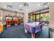 Fun-filled game room with arcade machines and an air hockey table, providing entertainment for all ages at 12527 Floridays Resort Dr # E104, Orlando, FL 32821