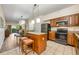 Kitchen with stainless steel appliances, stone countertops, and center island at 12527 Floridays Resort Dr # E104, Orlando, FL 32821