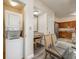 Bright laundry room featuring a stacked washer and dryer and a makeup vanity at 12527 Floridays Resort Dr # E104, Orlando, FL 32821