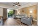 Relaxing living room with balcony and a ceiling fan at 12527 Floridays Resort Dr # E104, Orlando, FL 32821