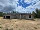 New construction featuring a spacious front yard, attached garage, and a classic architectural design at 12756 Sw 80 St, Dunnellon, FL 34432