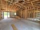 Interior view showcases the home's layout with exposed framing, highlighting its spacious design and potential at 12756 Sw 80 St, Dunnellon, FL 34432