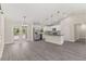Open concept kitchen with stainless steel appliances, granite countertops, and pendant lighting at 12756 Sw 80 St, Dunnellon, FL 34432