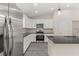 Gourmet kitchen featuring stainless steel appliances and white cabinets at 12756 Sw 80 St, Dunnellon, FL 34432