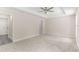 Spacious main bedroom features a tray ceiling and neutral carpeting at 12756 Sw 80 St, Dunnellon, FL 34432