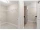 Spacious walk-in closet with wire shelving and tile floor located off bathroom at 12756 Sw 80 St, Dunnellon, FL 34432