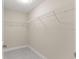 Spacious walk-in closet with wire shelving and tile floor at 12756 Sw 80 St, Dunnellon, FL 34432