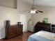Spacious bedroom featuring a ceiling fan, dresser, and a rolltop desk at 13000 Sandy Pine Ln, Clermont, FL 34711