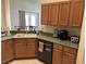 Functional kitchen with modern appliances, ample counter space, and wood cabinets at 13000 Sandy Pine Ln, Clermont, FL 34711