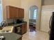 Kitchen with stainless steel appliances, a built-in dishwasher, and views into adjacent sitting room at 13000 Sandy Pine Ln, Clermont, FL 34711