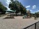 A fun neighborhood playground with a slide and covered picnic area, creating a safe recreational space at 13000 Sandy Pine Ln, Clermont, FL 34711