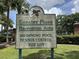 Greater Pines recreation area sign featuring a swimming pool, tennis courts, and tot lot at 13000 Sandy Pine Ln, Clermont, FL 34711