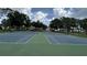Pair of community tennis courts, a great place for residents to play tennis at 13000 Sandy Pine Ln, Clermont, FL 34711