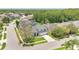 An aerial view of a well-maintained home, showing its three-car garage and manicured landscaping at 13691 Crystal River Dr, Orlando, FL 32828