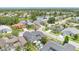 Overhead view of the property in a scenic neighborhood near a pond, showcasing the backyard pool at 13691 Crystal River Dr, Orlando, FL 32828
