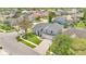 Aerial view of a well-maintained home showcasing a three-car garage and a manicured front lawn at 13691 Crystal River Dr, Orlando, FL 32828