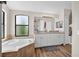 Bright bathroom features double vanity, soaking tub, and tile floors at 13691 Crystal River Dr, Orlando, FL 32828