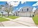 Attractive home with three-car garage, well-maintained lawn, and decorative windows at 13691 Crystal River Dr, Orlando, FL 32828
