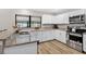 Bright kitchen features granite countertops, stainless steel appliances, and backsplash at 13691 Crystal River Dr, Orlando, FL 32828