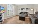 Bright living room with hardwood floors, large windows, and comfortable seating at 13691 Crystal River Dr, Orlando, FL 32828