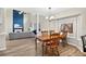 Cozy dining area flowing into a living room with vaulted ceilings and a modern fireplace at 13691 Crystal River Dr, Orlando, FL 32828