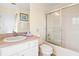 Clean and functional bathroom with shower-tub combo, single sink vanity, and neutral finishes at 1428 Solana Cir, Davenport, FL 33897