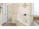 Close-up of a bathroom featuring a soaking tub and glass shower enclosure at 1428 Solana Cir, Davenport, FL 33897