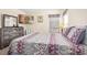 Inviting bedroom with a large TV, decorative pillows, and a window for natural light and comfortable ambiance at 1428 Solana Cir, Davenport, FL 33897