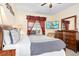 Cozy bedroom featuring a comfy bed with decorative pillows and a view to the outside at 1428 Solana Cir, Davenport, FL 33897