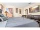 Cozy bedroom with a large TV, wooden dresser, and matching bedside lamps for comfortable living at 1428 Solana Cir, Davenport, FL 33897