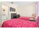 Cozy bedroom featuring twin beds, TV, and ensuite bath access, perfect for Gathering or guests at 1428 Solana Cir, Davenport, FL 33897