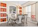 Dining area with stylish chandelier, decorative niches, seating for six and large windows for great light at 1428 Solana Cir, Davenport, FL 33897