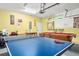 Large garage with ping pong and pool tables, a versatile space for recreation and Gathering fun at 1428 Solana Cir, Davenport, FL 33897