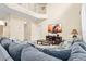 Inviting living room features high ceilings and comfortable seating around a large television at 1428 Solana Cir, Davenport, FL 33897