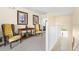 The second floor landing offers chairs and a small table with an opening to the first floor at 1428 Solana Cir, Davenport, FL 33897