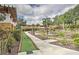 Scenic mini golf course surrounded by lush greenery, offering a fun recreational activity for residents at 1428 Solana Cir, Davenport, FL 33897