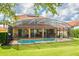 Enjoy the refreshing pool in this screened-in backyard, perfect for outdoor relaxation and entertaining at 1428 Solana Cir, Davenport, FL 33897