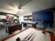 Large game room includes pool table, foosball, air hockey, and a vibrant, playful atmosphere at 150 Barefoot Beach Way, Kissimmee, FL 34746