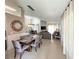 Open-concept living and dining area with tile flooring and high ceilings for a spacious feel at 150 Barefoot Beach Way, Kissimmee, FL 34746