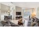 Inviting living room with comfortable sofas and sliding glass doors leading to the pool area at 150 Barefoot Beach Way, Kissimmee, FL 34746