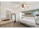 Relaxing main bedroom with a ceiling fan, natural light, and calming color palette at 150 Barefoot Beach Way, Kissimmee, FL 34746