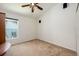 Bedroom featuring a ceiling fan, window, and closet with bright and airy tones at 1646 Song Sparrow Ct, Sanford, FL 32773