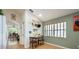 Cozy breakfast nook featuring tile flooring, hanging pot rack, natural light, and dining space at 1646 Song Sparrow Ct, Sanford, FL 32773
