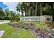 Elegant entrance sign for Lake Jesup Woods with manicured landscaping and a welcoming feel at 1646 Song Sparrow Ct, Sanford, FL 32773