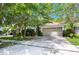 Charming single Gathering home featuring a manicured lawn, brick driveway, and attached two car garage at 1646 Song Sparrow Ct, Sanford, FL 32773