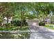 Charming home exterior with a well-maintained lawn, beautiful landscaping, and a two-car garage at 1646 Song Sparrow Ct, Sanford, FL 32773
