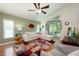 Inviting living room with hardwood flooring, neutral paint, comfortable seating, and sliding glass doors at 1646 Song Sparrow Ct, Sanford, FL 32773