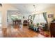 Spacious living room area with hardwood flooring, recessed lighting, and dining space in the background at 1646 Song Sparrow Ct, Sanford, FL 32773