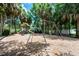 Community playground featuring swings and a play structure, perfect for families with children at 1646 Song Sparrow Ct, Sanford, FL 32773